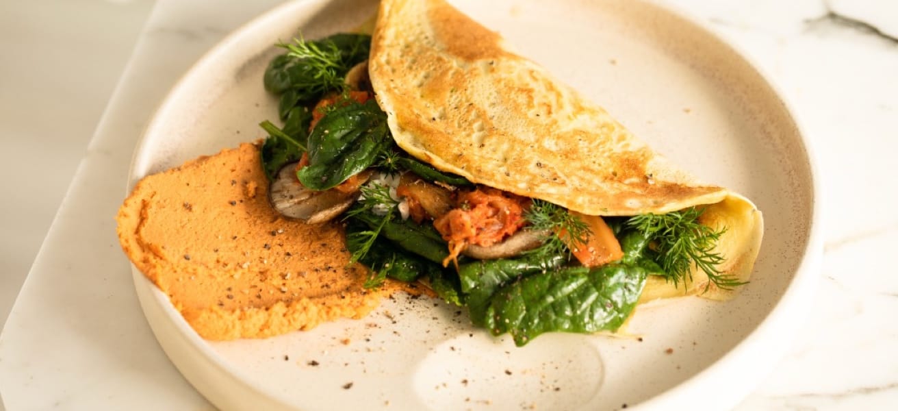 picture of delicious omelette with vegetables inside